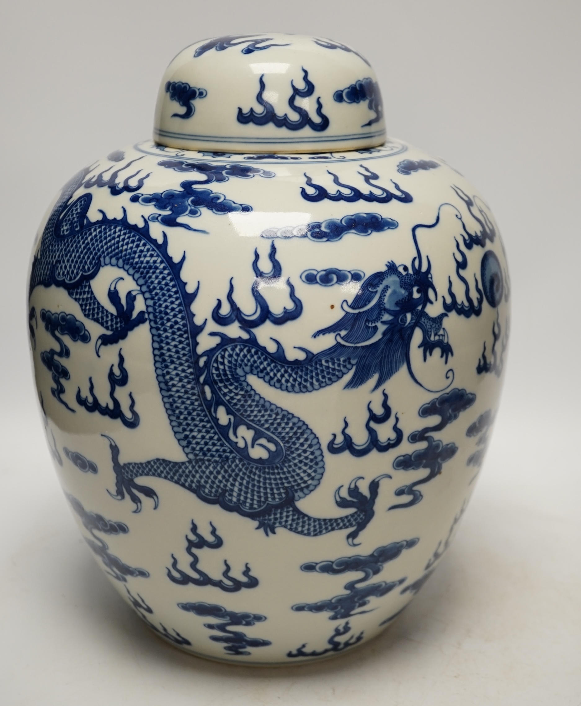 A large Chinese blue and white ‘dragon’ ginger jar and cover, 32cm